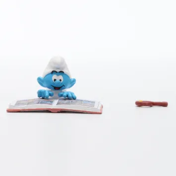 De Smurfen met een stripboeken kist